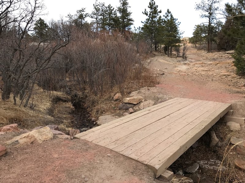 Wooden bridge near the parking lot.