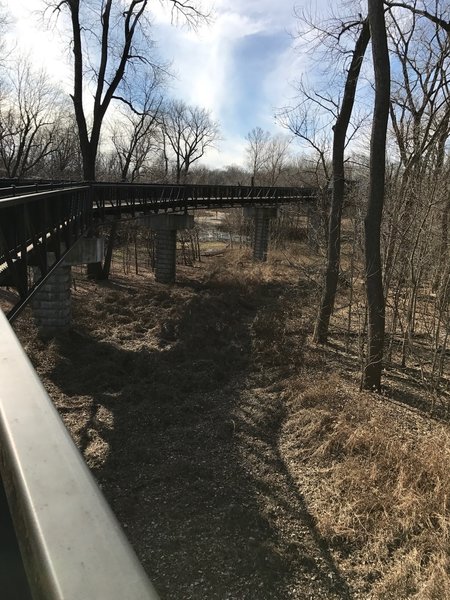 A sturdy bridge allows the Mississippi River Greenway to travel through this area.