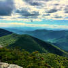 The summit of Blue Ridge Pinnacle looks out over the Craggies and Graybeard.