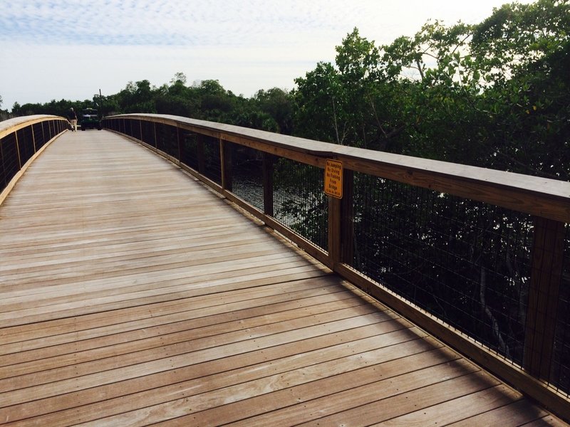 A boardwalk bridge travels over the Gordon River on the Gordon River Greenway.