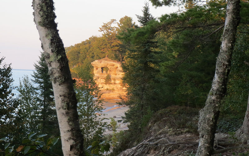 Chapel Rock peeks through the trees along the North Country Trail.