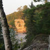 Chapel Rock peeks through the trees along the North Country Trail.