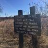 An informative sign marks the entrance to the Prairie Trail.