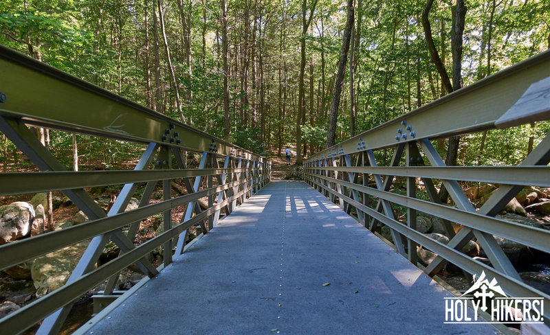 Enjoy this sturdy bridge over the stream.