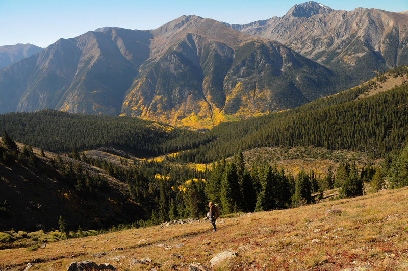 A lone hiker enjoys the solitude and fall colors on the south approach to Mount Elbert.