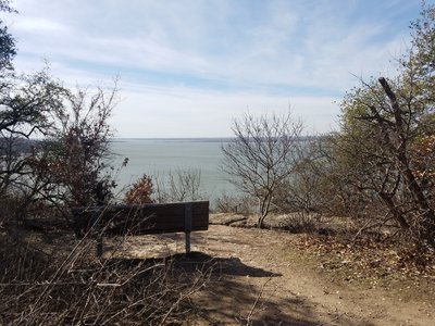 Beyond the bench are several rock ledges that offer good seating and better views of one of the prettiest lakes in North Texas.
