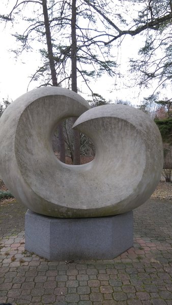 An "Untitled" sculpture stands near the entrance to the trail.