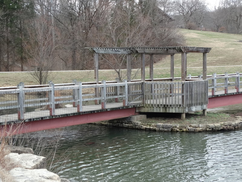 A bridge provides access across the lake.