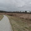 The trail is gravel on the prairie side of the Two Ponds Loop.