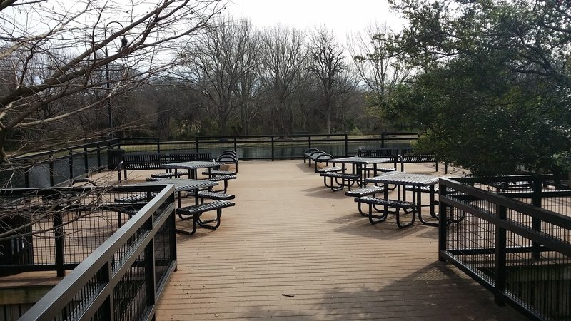 Enjoy the pond and surrounding nature from this great picnic spot along the trail.