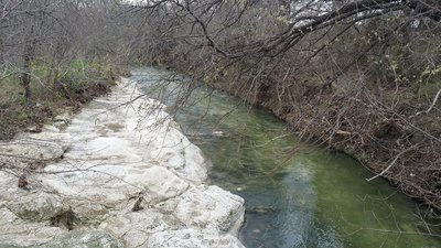 Rowlett Creek gurgles below as you pass over it on the bridge.