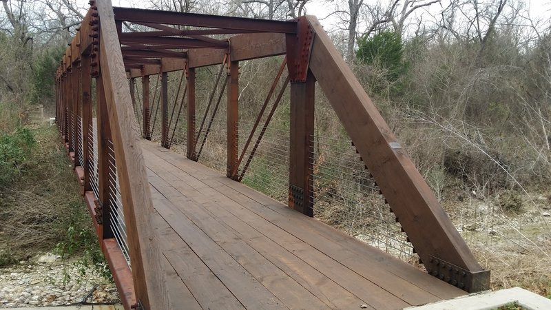 There are multiple sturdy bridges that pass over Beck Creek.