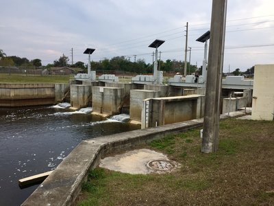Melbourne-Tillman Water Control District Dam can be seen from the Turkey Creek Sanctuary Hiking/Jogging Trail. This marks the south end of Turkey Creek where it becomes the channelized canal.