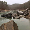 The South Fork of the Cumberland River meanders peacefully alongside the trail.