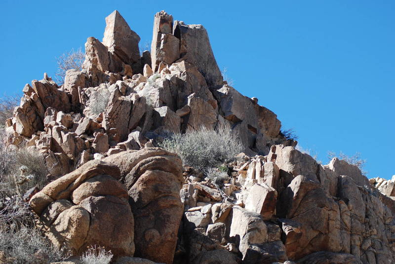 Looking up to the peak from the eastern descent, you get a good sense of just how craggy these rocks are.