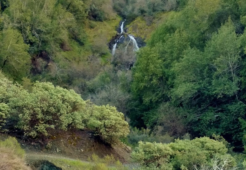 A waterfall splits as it tumbles down a rock face along the Limekiln Trail on its way to Lexington Reservoir.