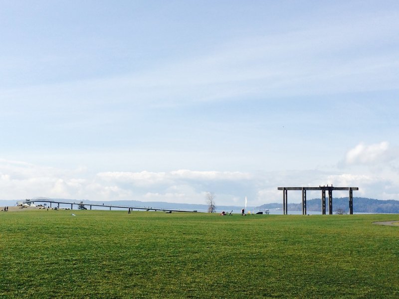 The distant bridge leads visitors over the train tracks to the beach below. While enjoying Chamber's expansive meadow area, take a look at the concrete infrastructure left from this area's days as a working gravel mine.