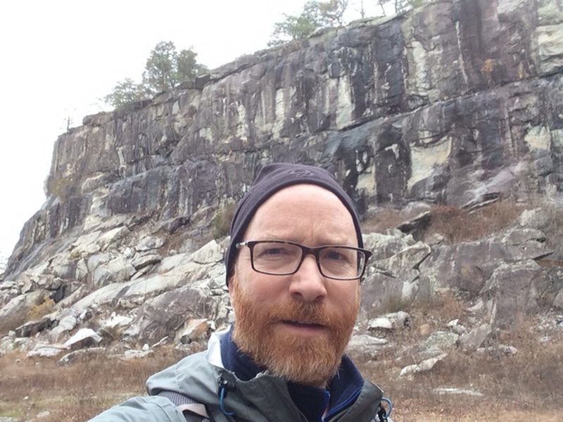 Walk under the rocky face to get to/head back from the Grindstone Trail.