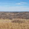 Enjoy spectacular views of a distant downtown Denver from the Meadowlark Trail.