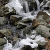 A small waterfall cascades into Lake Skemonto.