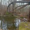 The remains of a former bridge over the Scantic River still stand near the trailhead.