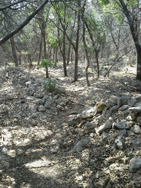 The Goldwater Loop Trail makes a pass through an old rock wall.