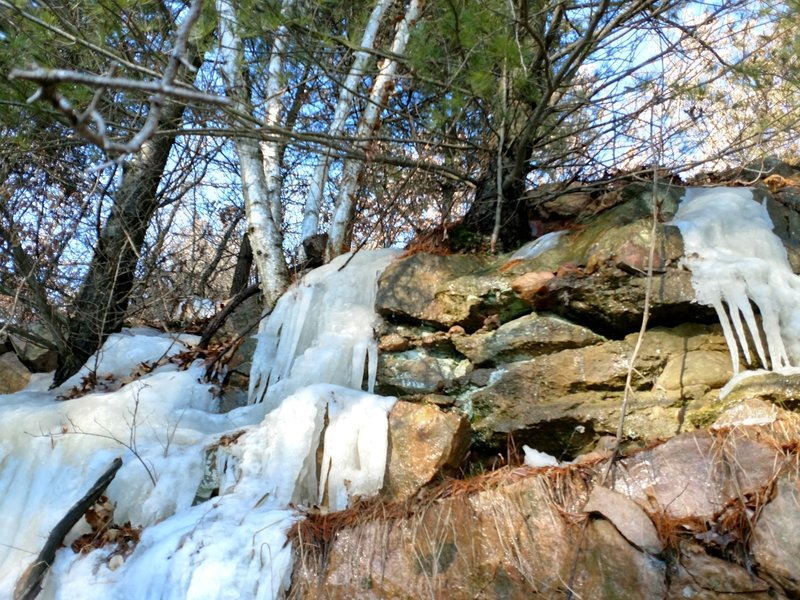 Frozen water streams down the rocks near Badger Overlook.