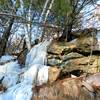 Frozen water streams down the rocks near Badger Overlook.