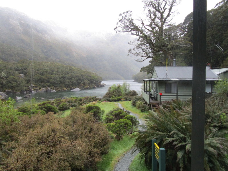 Lake MacKenzie looks beautiful in the fog from MacKenzie Hut along the Routeburn Track.