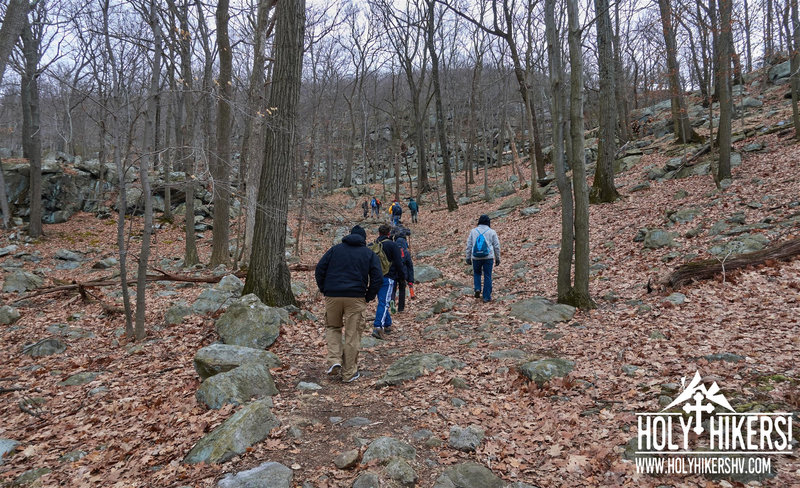 The group makes their way to the base of the torne.