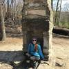 A human-sized chimney marks the intersection of the Stone Mountain Loop Trail and the spur to the upper parking area.