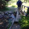 A narrow footbridge aids your passage over Corral Creek near the trailhead.