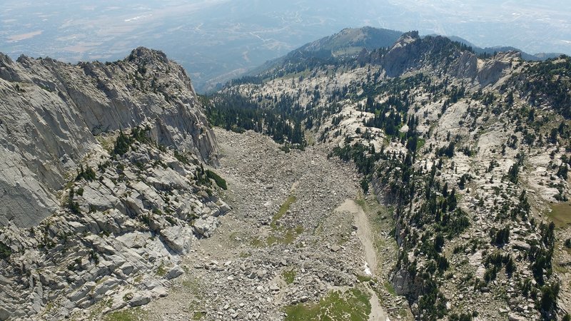 Alpine glaciers have carved a steep cirque from the western side of Lone Peak.