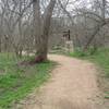 The well-maintained gravel/dirt surface of the Pecan Grove Trail provides an enjoyable soft surface for your feet.