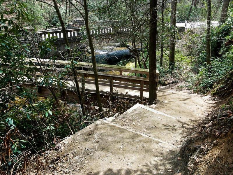 Start the trail by crossing a sturdy wooden bridge over the gurgling Looking Glass Creek.