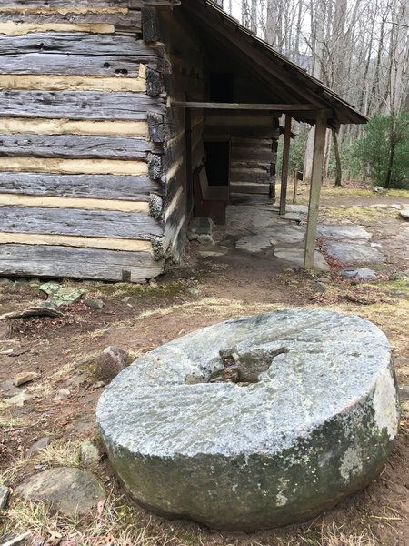 An old millstone speaks to Messer Barn's history.