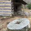An old millstone speaks to Messer Barn's history.