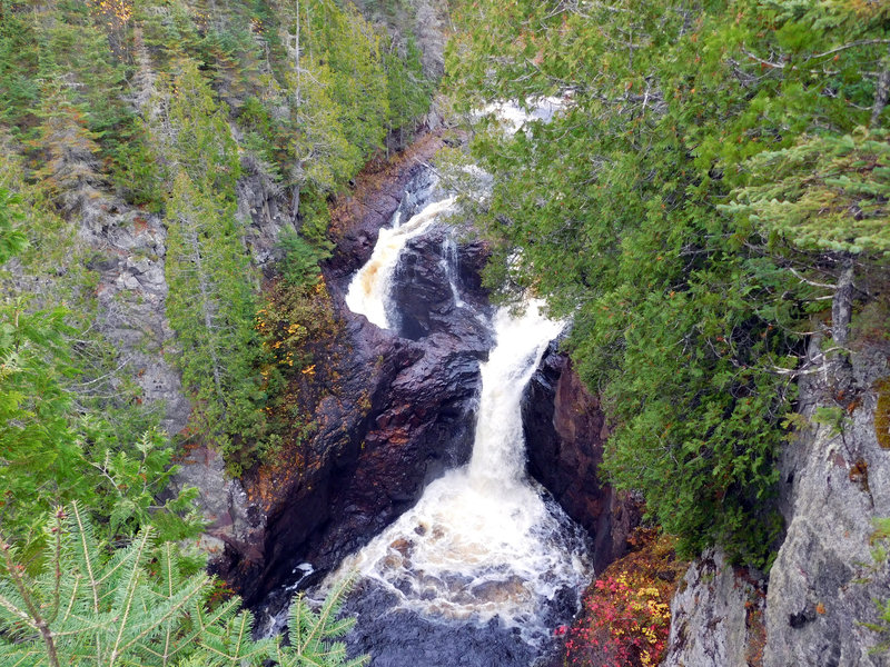 The mysterious Devil's Kettle drops through forest and bedrock to the water below.