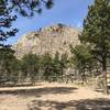 The trail starts just past the fence and heads to the top of Signal Butte.