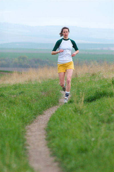 A runner finishes up a lap on the Whitetail Trail at Bennington Lake.