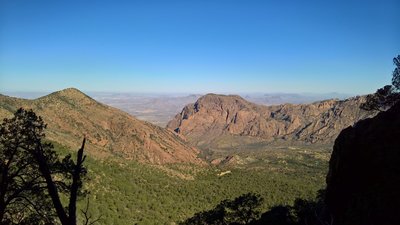 From the Pinnacles Trail, enjoy this view of The Window and Chisos Basin before cresting the trail near Emory Peak and the Boot Canyon Trail.