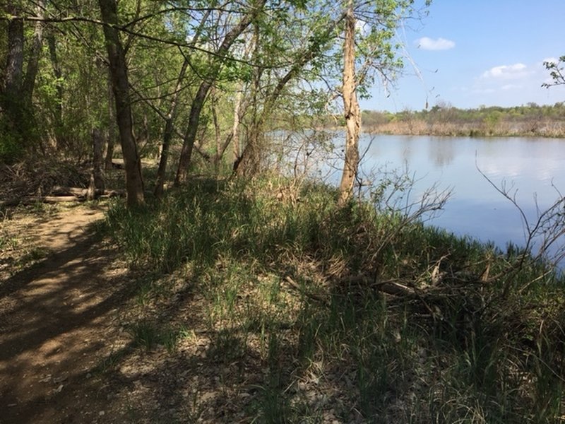 The trail follows along the river.