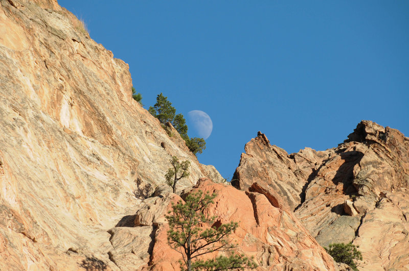 The moon hides behind Gray Rock.