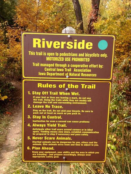 A sign marks the beginning of Riverside.