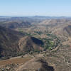 Enjoy the view looking back at El Monte County Park from the prow of El Cajon Mountain.