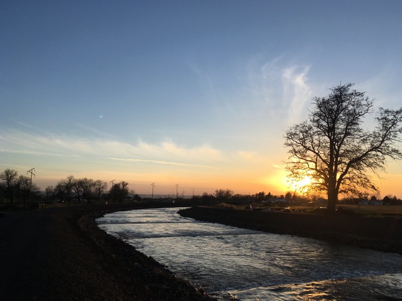 The sun sets over Mill Creek.