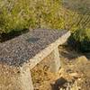 The Eastwing Mountain Trail hosts a pleasant memorial bench on which you can sit, reflect, and enjoy the view.