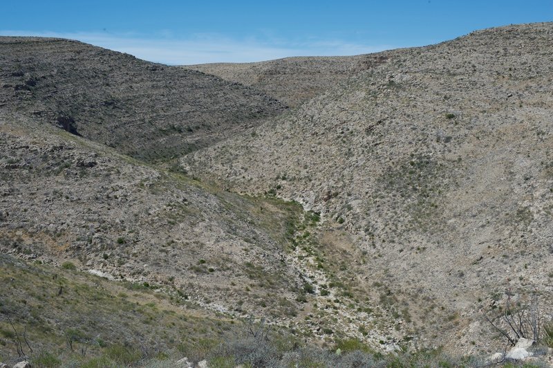 On the left-hand side of the trail, canyons can be seen weaving through the national park.