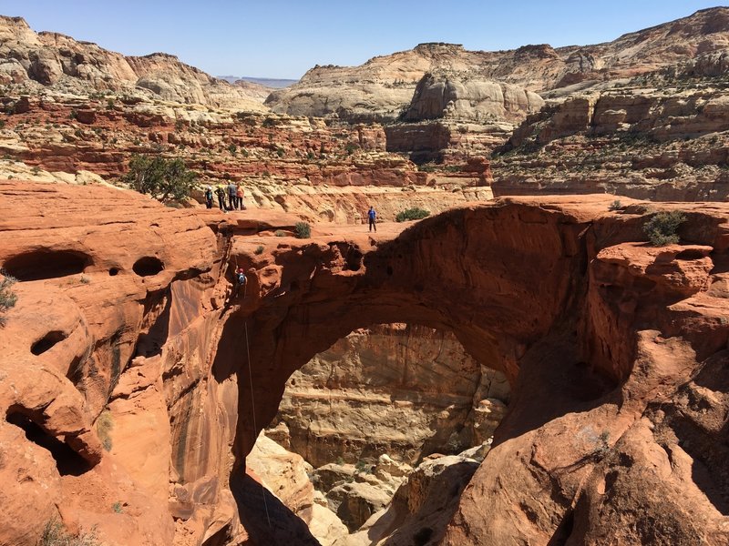 A hiker for reference displays this arch's massive scale.