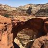 A hiker for reference displays this arch's massive scale.